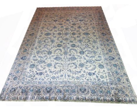 VERY FINE KASHAN CARPET, 422cm x 323cm, all over design of scrolling vines and palmettes in shades of azure on a jade field. 