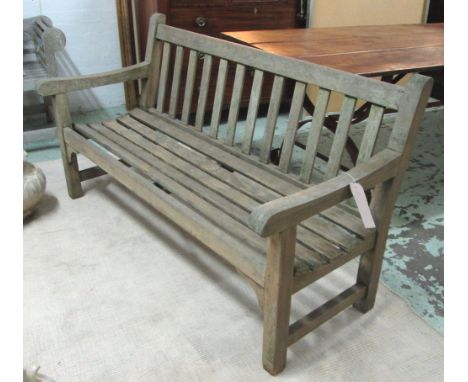 GARDEN BENCH, weathered teak by Lister of slatted construction, 150cm W.