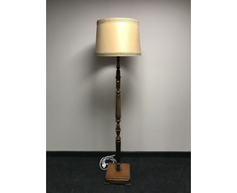 An early 20th century oak standard lamp 