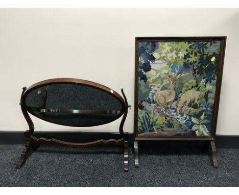 A mahogany dressing table mirror and an oak tapestry fire screen 