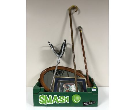 A box of ornate gilt framed mirror, teak mirror, Eastern picture, badger topped walking stick, shepherd's crook and a shootin