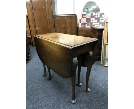 An oak gate leg table and a mahogany commode chair 