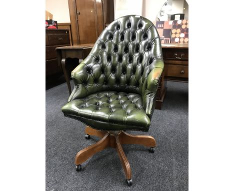 A green button Chesterfield swivel office armchair 