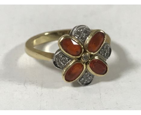 An 18ct gold fire opal and diamond cluster ring, size N.