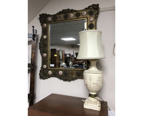 An ornate French style gilt framed mirror and a table lamp 
