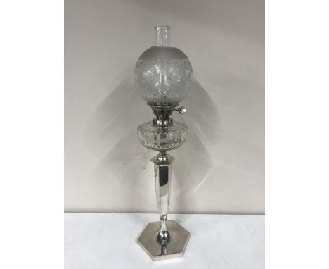 A good quality silver plated Evered & Co oil lamp with glass chimney and shade 