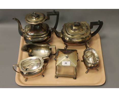 A silver plated Walker & Hall four-piece tea service, an associated milk jug and a swing-handled biscuit jar (6)