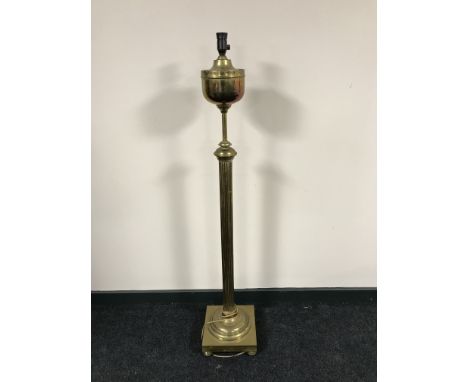A brass rise and fall standard lamp 
