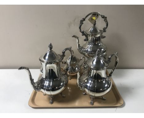 A four-piece 20th century plated tea service and matching spirit kettle 