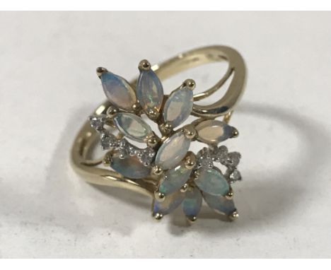 A 9ct gold opal and diamond cluster ring, size T/U