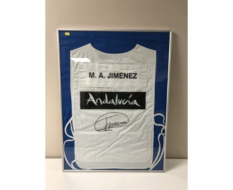 A signed, framed M. A. Jimenez golfing caddy vest from the Andalucia Open