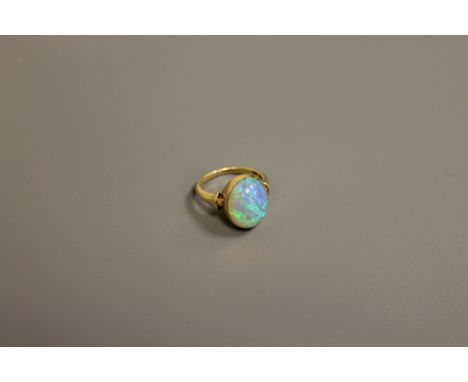 A fine quality opal ring set in 18ct gold, size K.