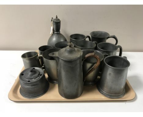 A tray containing a quantity of assorted pewter ware including inkwell, tankards, two pewter coffee pots 