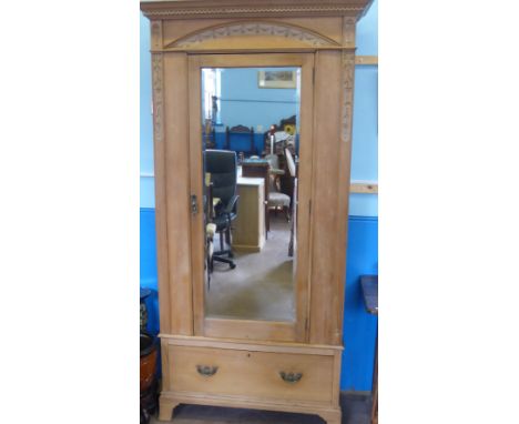 A Vintage Pine Wardrobe, the wardrobe having a mirrored door with drawer below, on raised feet, approx 92 x 41 x 209 cm.