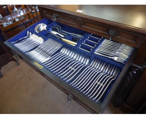 An Oak Cutlery Chest, barley twist supports, the interior double drawers fitted for a set of silver plate flatware 'Rat Tail'