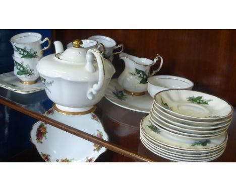 A Fine Bone China Tea Set, 'Luberne' with 22 k Gold Trim, comprising rectangular sandwich plate, cake plate, tea pot, sugar b