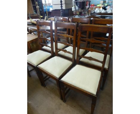 Six Antique Oak Ladder Back Dining Chairs with two Carvers, in the Arts & Crafts style, turned legs with straight stretchers.