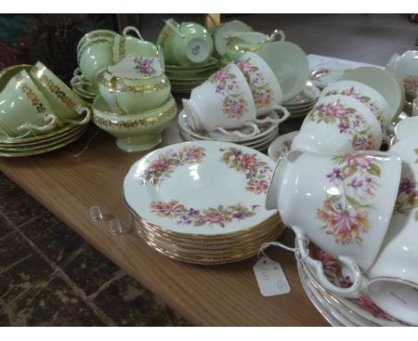 A Colclough Bone China Tea Set, comprising tea pot, milk jug, two sugar bowls, seven cups, ten saucers, seven cake plates, a 