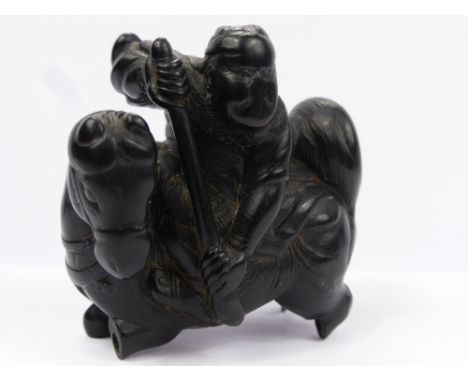 An Antique Japanese Ebony Carved Netsuke, depicting a mounted warrior, approx 4.5 x 4 cms (af) Provenance: From a private col