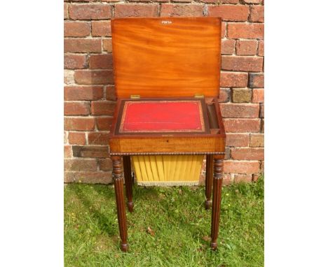 A Lady's 19th Century Work Table, a red tooled leather writing slope with fitted interior, single drawer to front and sewing 