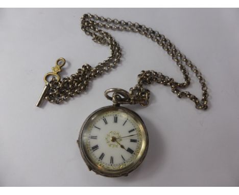 A Lady's Antique Open Face Pocket Watch, on solid silver chain, the watch having white enamel gilded face with Roman numerals