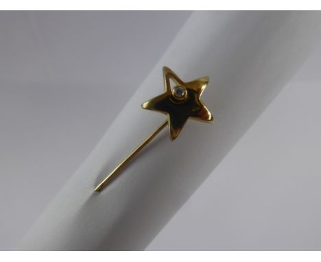 A 9 ct Gold Ortak and Diamond Tie Pin, in the form of a star, approx 2.2 gms.