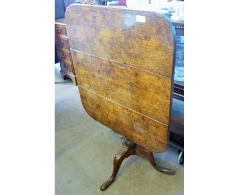 An Antique Oak Tilt Top Table, on tripod pad foot base, approx 65 x 70 x 65 cms.