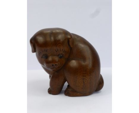 A Meiji Period Japanese Box Wood Netsuke, beautifully carved netsuke of a seated puppy, with a rich patina, character marks t