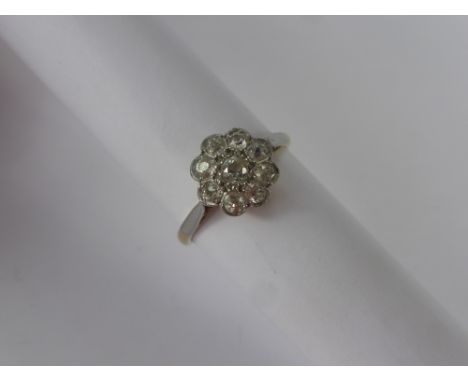 A Lady's 18 ct Antique Gold and Platinum Diamond Cluster Ring, size P, approx 50 pts of old cut dias, approx wt 3.3 gms.