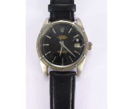A Gentleman's Chrome Plated Vintage Automatic Wrist Watch. The watch having a black Rolex face with date aperture, an unmarke