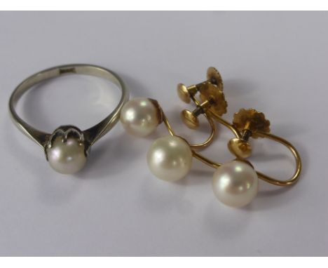 A Lady's 18 ct White Gold and Pearl Ring, size O, together with three 9 ct screw on pearl earrings, total approx wt 5 gms.