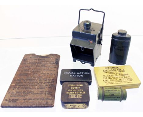 A quantity of WW2 military equipment including a bicycle lamp, anti gas eyeshields, water sterilizing tablets etc