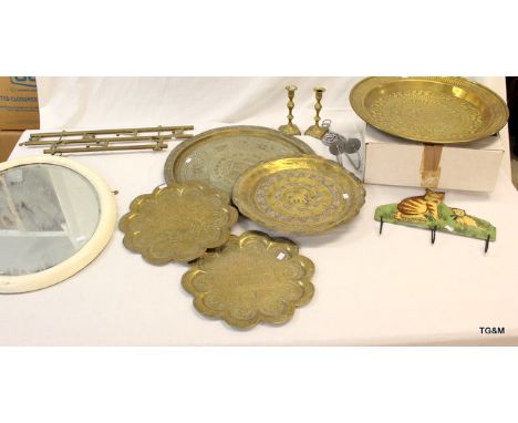 An Oval bevelled edged white painted wall mirror 56 x 46cm, 5 brass chargers, cat coat hanger, brass coat hanger and 4 x cand
