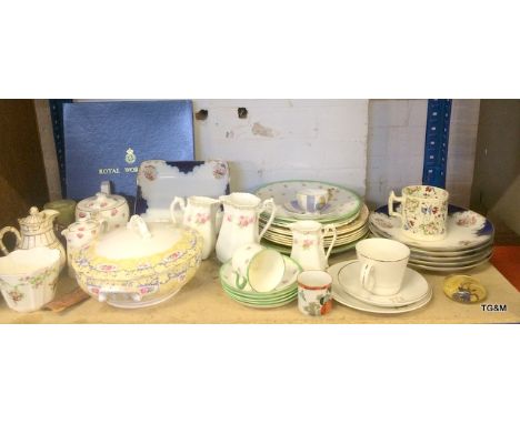 A shelf full of miscellaneous China items