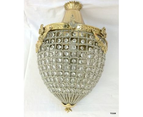 A large brass swag style light
