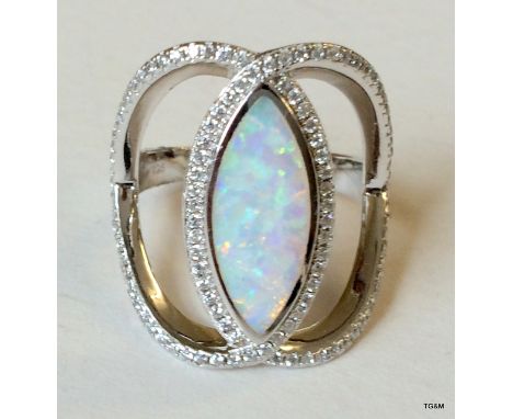 A silver cz and white opal dress ring