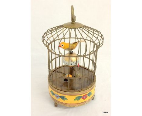 A brass cased automaton style bird clock