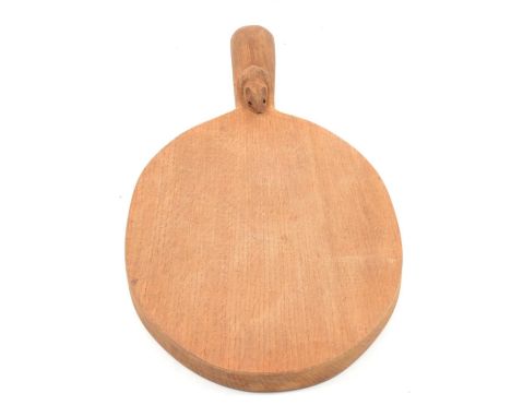 A Robert "Mouseman" Thompson of Kilburn oak cheese board with carved mouse signature to handle, length 38cm