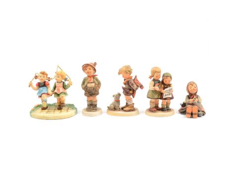 Collection of sixteen Hummel pottery figures, and a Hummel plate.