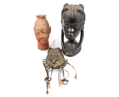 Ethnographica interest - a Fulani cattle man's metal purse, Nigerian carved bust, Benin terracotta bust.