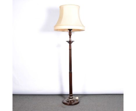 Mahogany standard lamp, fluted column, circular base, height 96cm, with shade.