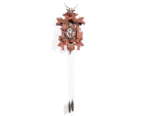 Black Forest carved soft wood cuckoo clock, double weight driven movement, 50cm; a stained wood barometer, with thermometer o