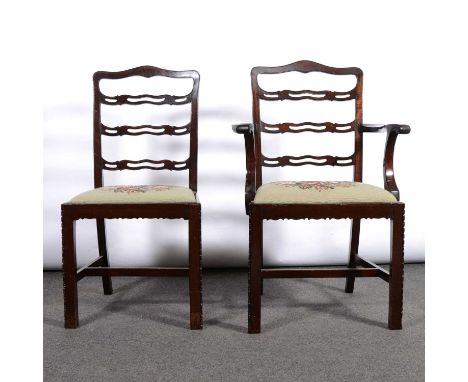 Mahogany dining suite, in the Georgian style, comprising a set of eight chairs, open wavy ladder-backs, upholstered seats, mo