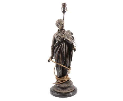 Figural patinated spelter table lamp, modelled as a scholar, on a turned and ebonised socle, overall height 60cm.