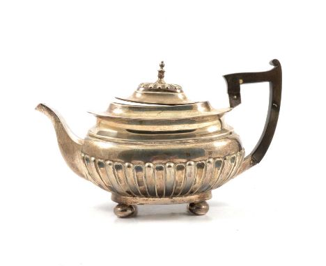 Silver teapot, Walker &amp; Hall, Sheffield 1904, half gadrooned body, on four bun feet, composition handle, 17cm, approx. 27