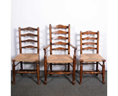 A harlequin set of eight ladder-back dining chairs, 19th century, each with rush seats, including a near pair of elbow chairs