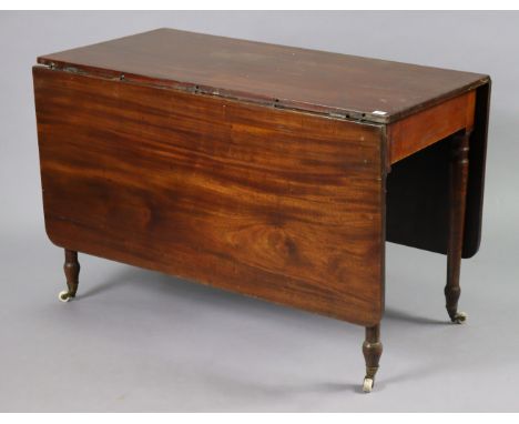 A 19th century mahogany drop-leaf dining table on four turned tapered legs with ceramic castors, 117.25cm wide x 78cm high. 