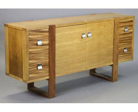 A Wood Brother’s light oak &amp; mahogany sideboard with cupboard to centre enclosed by a pair of panel doors flanked by two 