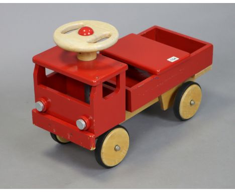 A vintage painted wooden ride-on toddler’s fire-engine, 56.5cm long. 