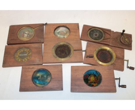 Eight various Victorian hand rotated and adjusted lantern-style slides on wooden frames including brass mounted kaleidoscope-